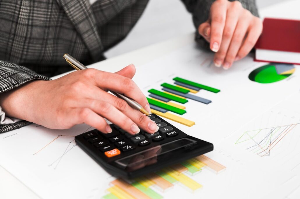 Woman counting on a calculator