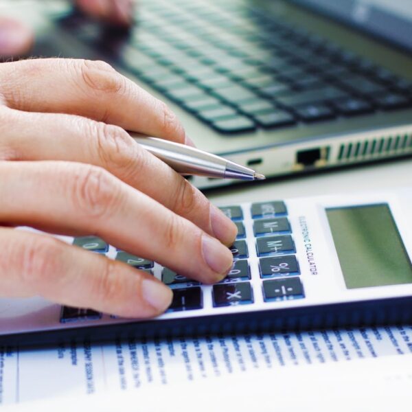 Man counting on a calculator